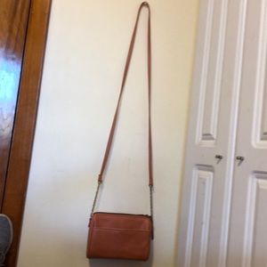 Cute orange purse. Card organizer and zip pocket on inside. Pocket on outside.